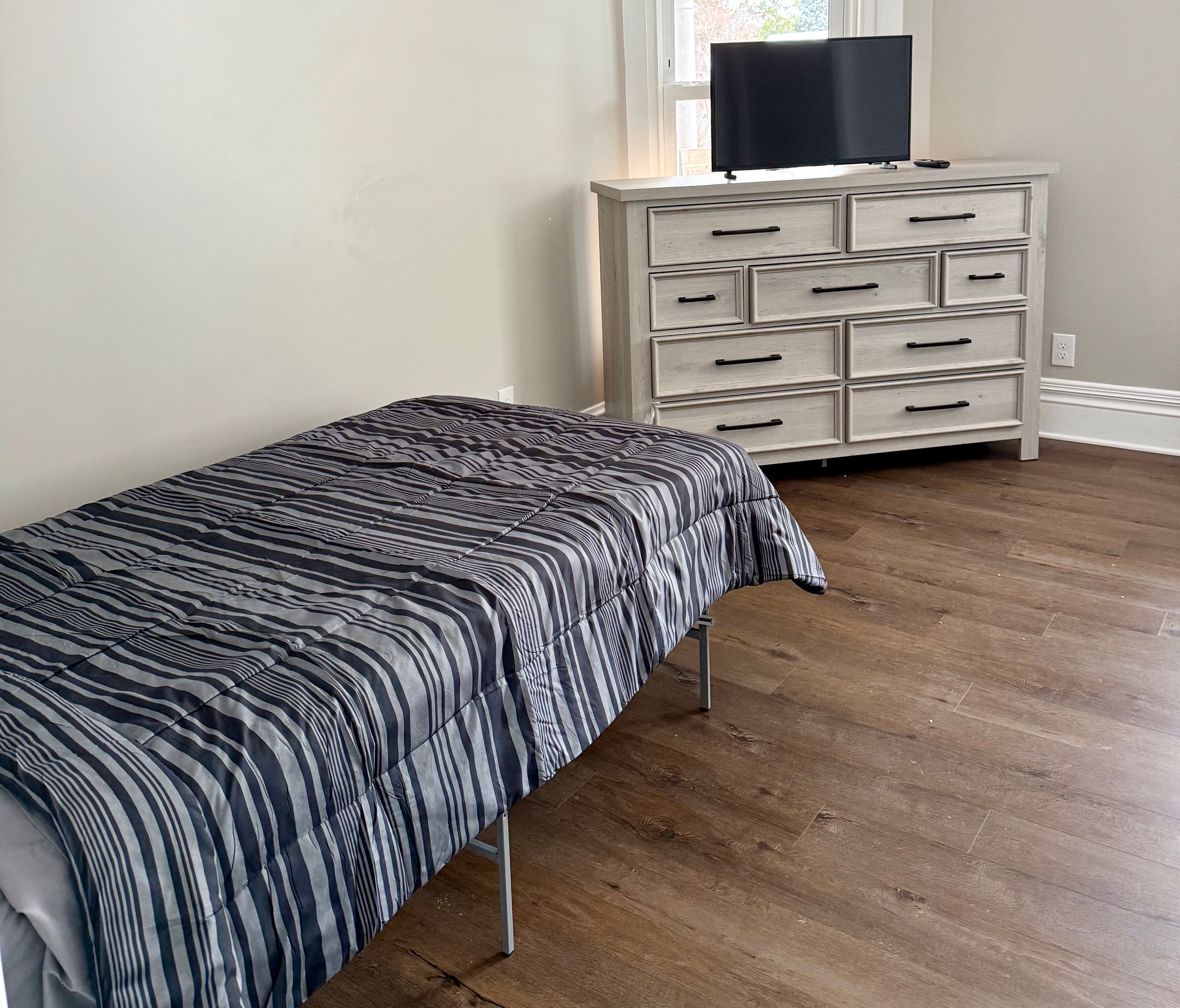 Clyde bedroom with dresser and TV