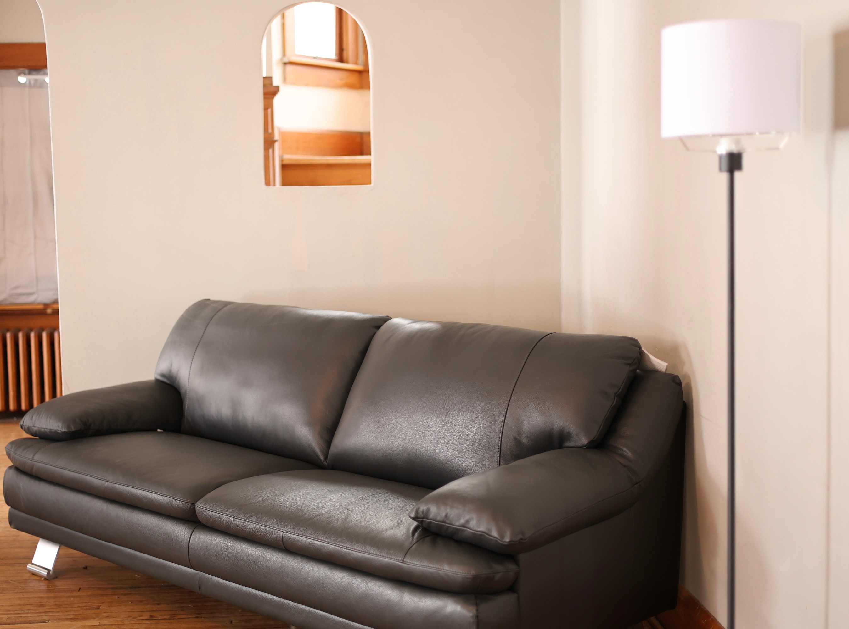 Mansfield living area with couch and lamp
